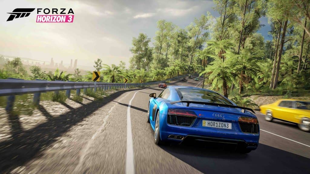 Lái xe khám phá cảnh quan nước Úc trong Forza Horizon 3 Xe Audi R8 màu xanh lam chạy trên đường cao tốc ven biển ở Úc trong Forza Horizon 3