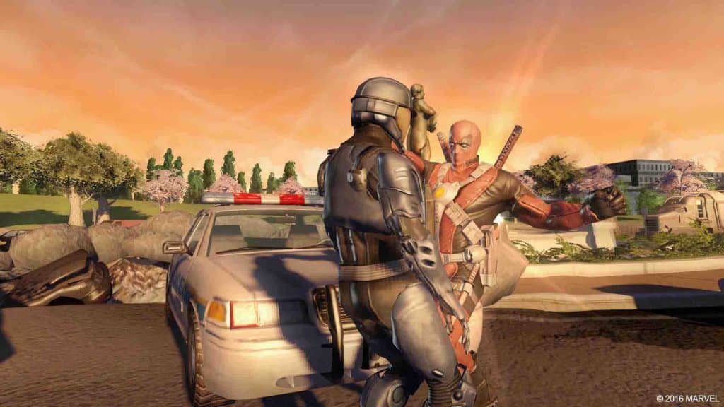 Trải nghiệm cuộc phiêu lưu của Deadpool trong Marvel Ultimate Alliance 2. Marvel Ultimate Alliance 2 - Deadpool và lính đặc nhiệm S.H.I.E.L.D. đứng cạnh một chiếc xe cảnh sát.