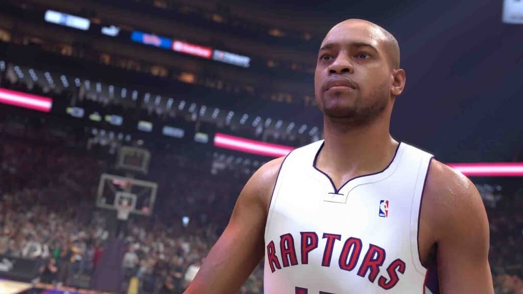 Khám phá đồ hoạ chân thực và lối chơi đỉnh cao của NBA 2K25. NBA 2K25 - Cầu thủ của đội Toronto Raptors đứng trên sân đấu nhìn về phía trước.
