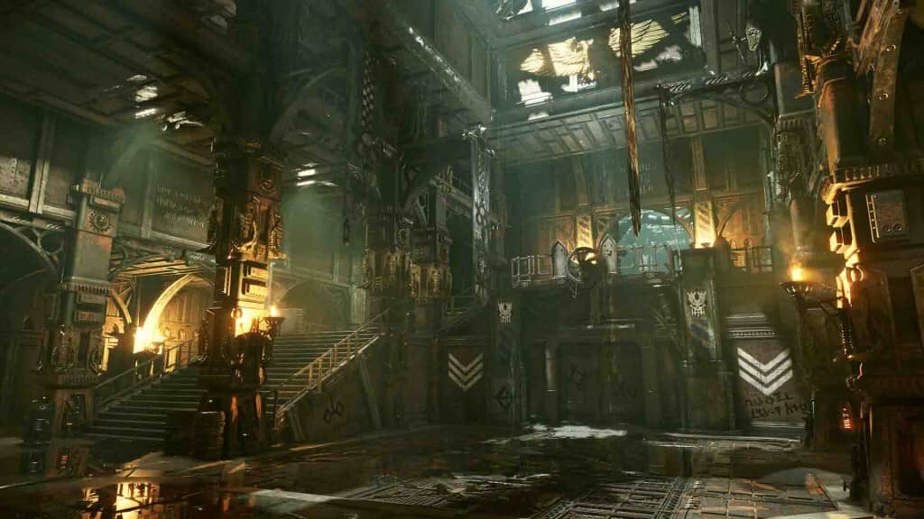 Warhammer 40,000: Darktide - Cận cảnh một phân xưởng công nghiệp cũ với ánh sáng chiếu qua.