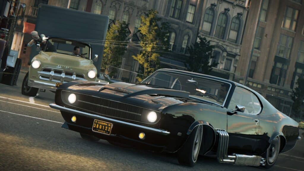 Xe cổ điển và không khí đường phố những năm 1960 của Mafia III Xe cơ bắp màu đen và một chiếc xe bán tải cổ điển trên đường phố New Bordeaux trong Mafia III Definitive Edition