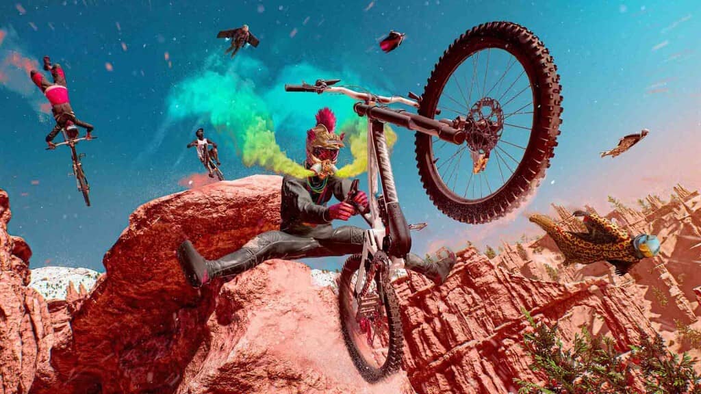 "Cảnh nhảy xe đạp mạo hiểm trong game" "Ảnh gameplay game thể thao mạo hiểm, một tay đua xe đạp đang thực hiện cú nhảy mạo hiểm trên một vách đá có nhiều màu sắc, tạo ra hiệu ứng khói màu phía sau."