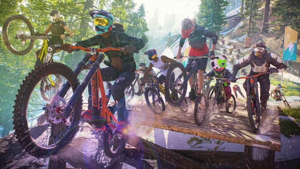 "Cảnh đua xe đạp địa hình trong game" "Ảnh gameplay game thể thao mạo hiểm, một nhóm vận động viên đua xe đạp đang cạnh tranh nhau trên một đường đua địa hình đầy chướng ngại vật."
