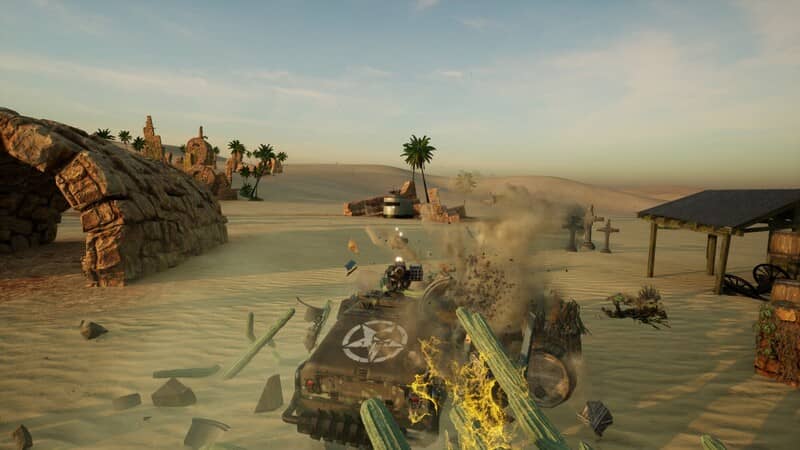 Chiến trường hỗn loạn trong Chaos on Wheels Ảnh gameplay Chaos on Wheels, một trận chiến xe độ đang diễn ra trên một sa mạc rộng lớn với nhiều công trình kiến trúc đổ nát. Các vụ nổ và khói bụi tạo nên một khung cảnh hỗn loạn.