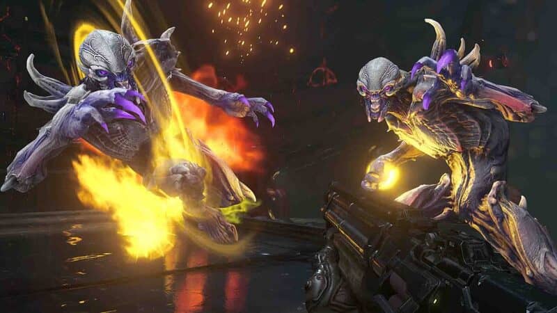 Chiến đấu với quỷ trong DOOM Eternal Ảnh gameplay game DOOM Eternal, cảnh chiến đấu ác liệt giữa Doom Slayer và hai con quỷ phát sáng. Một con quỷ màu tím đang bị tấn công và bốc cháy, thể hiện sự tàn bạo và tốc độ của trận chiến.