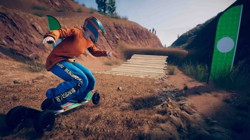  Gameplay Descenders Next: Người chơi điều khiển xe địa hình 4 bánh lao nhanh trên con đường đất gồ ghề, hai bên là sườn đồi trọc và những biển báo đường đua, tạo cảm giác tốc độ và thử thách.