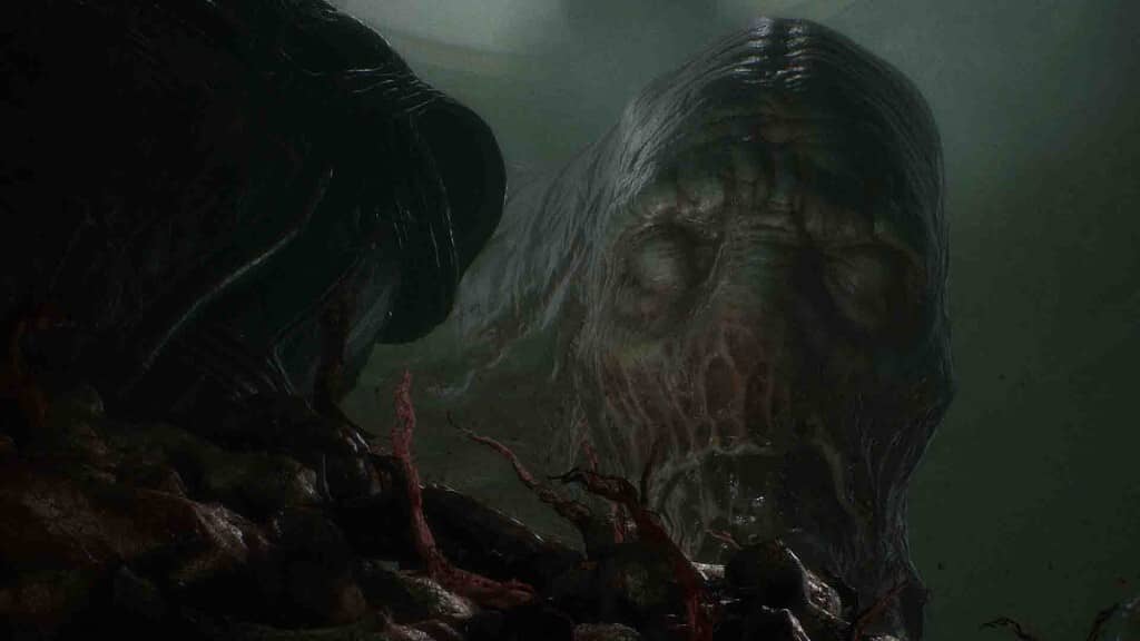 "Một con quái vật đáng sợ trong game Scorn" "Ảnh gameplay game Scorn, cận cảnh một sinh vật khổng lồ, xấu xí với nhiều xúc tu và bề mặt cơ thể giống da thịt nhăn nheo, đang nhìn chằm chằm vào màn hình. Bối cảnh tối tăm và kinh dị."