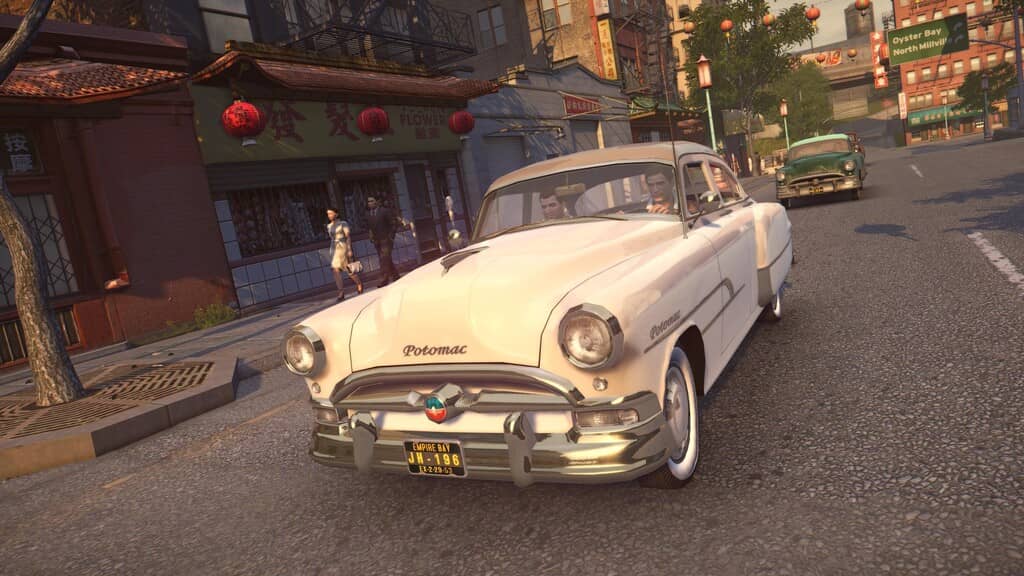 Ảnh gameplay Mafia 2 Definitive Edition xe hơi cổ điển trên đường phố Chinatown Mafia II Definitive Edition Việt Hóa - Xe cổ Potomac 1950s chạy trên phố Empire Bay