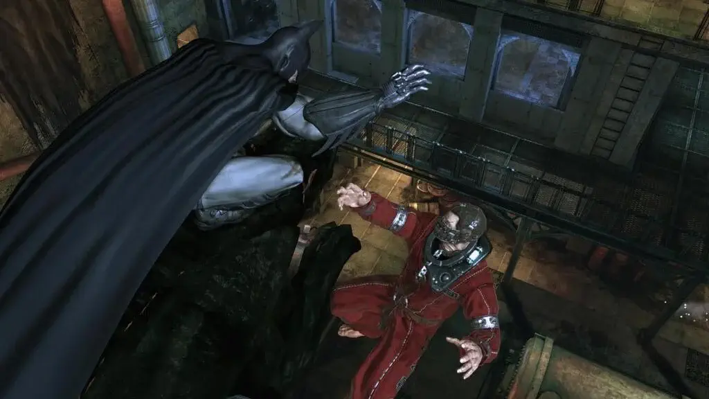 Lối chơi hành động lén lút (Stealth) từ trên cao trong Batman Arkham Asylum Game of the Year Edition.